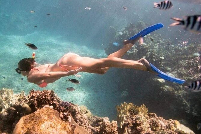 Bali ATV Quad Bike Adventure and Snorkeling Tour - Taking a local boat to two snorkeling sites