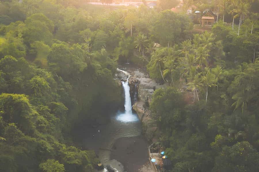 Bali: Blue Lagoon Snorkel, Kanto Lampo & Tibumana Waterfalls - Kanto Lampo’s dark rock steps