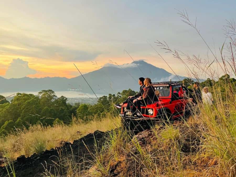 Bali: Mt Batur Jeep Sunrise & Taman Sari Waterfall Tour - Sunrise over Lake Batur and three mountain views