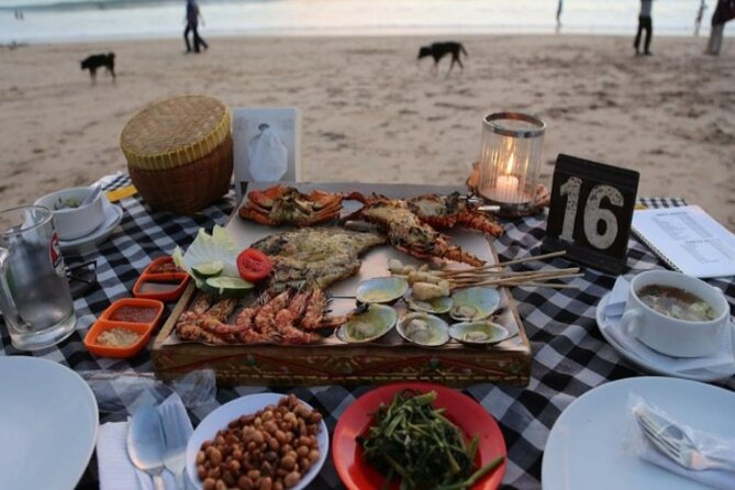 Bali Romantic Seafood Dinner under sunset jimbaran Beach - Private booking, public dining scene