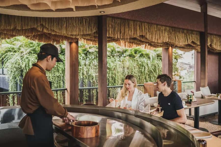 Bali/Sanur: Tsune Sushi & Flame Grill Bali E-Voucher - Reading the menu with a $12 credit