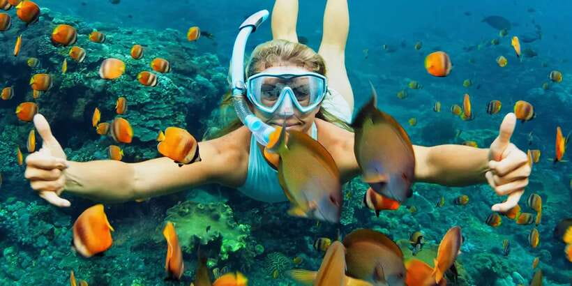 Bali: Snorkeling on 2 spots with Lunch and Transport - Blue Lagoon: colorful fish, coral, and busy water