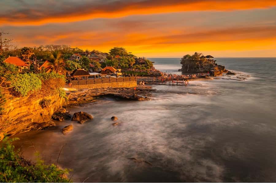 The sea temple at Tanah Lot with the tide coming in at golden hour