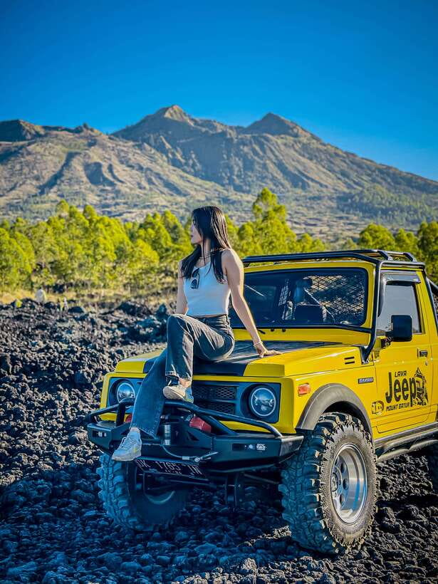 Bali: Sunset Mount Batur Jeep and Hot Spring All Inclusive - Black lava from the 1963 eruption