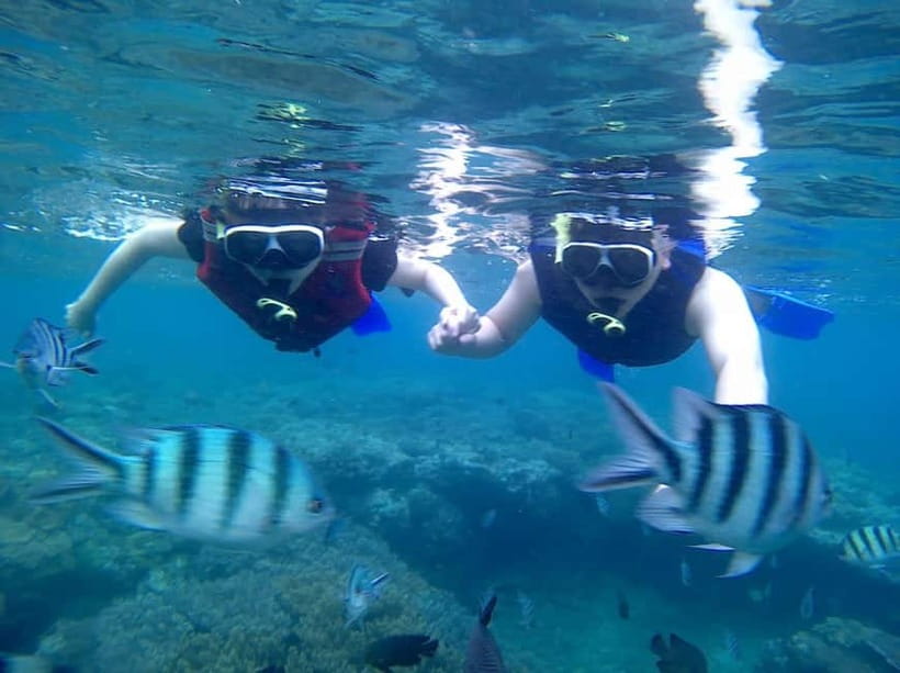 Blue Lagon Snorkeling, Waterfall, and Celuk Village Tour - Walking into Tukad Cepung Waterfall