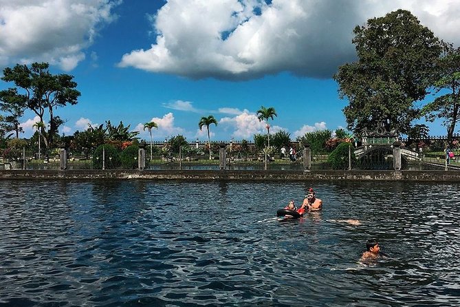 Lempuyang Gates of Heaven, Tirta Gangga Temple Swim & Jungle Waterfalls - Tukad Cepung and the rays inside the waterfall